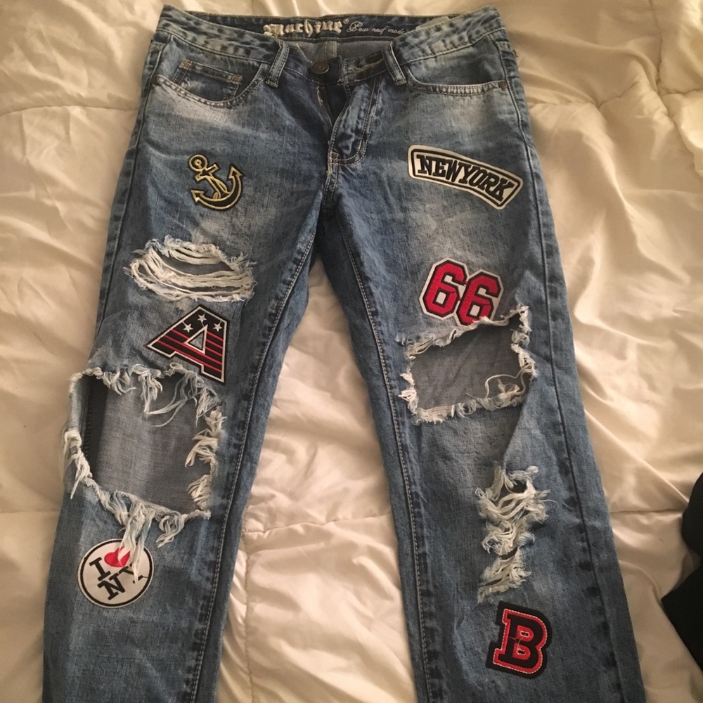 Ripped light washed jeans with patches